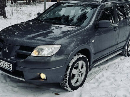 Сірий Міцубісі Аутлендер, об'ємом двигуна 2.4 л та пробігом 145 тис. км за 9200 $, фото 1 на Automoto.ua