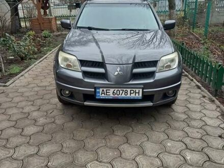 Серый Мицубиси Аутлендер, объемом двигателя 2.38 л и пробегом 143 тыс. км за 7300 $, фото 1 на Automoto.ua