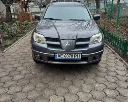 Серый Мицубиси Аутлендер, объемом двигателя 2.38 л и пробегом 143 тыс. км за 7300 $, фото 1 на Automoto.ua