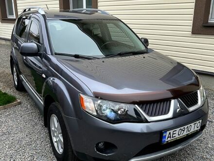 Серый Мицубиси Аутлендер, объемом двигателя 2.4 л и пробегом 153 тыс. км за 11500 $, фото 1 на Automoto.ua