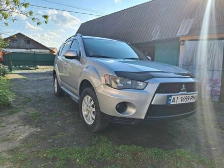 Серый Мицубиси Аутлендер, объемом двигателя 2.4 л и пробегом 150 тыс. км за 8300 $, фото 1 на Automoto.ua
