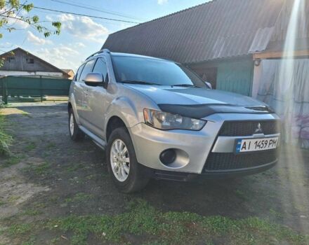 Серый Мицубиси Аутлендер, объемом двигателя 2.4 л и пробегом 150 тыс. км за 8300 $, фото 1 на Automoto.ua