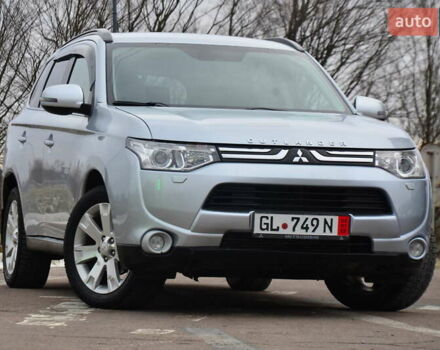 Серый Мицубиси Аутлендер, объемом двигателя 2.2 л и пробегом 243 тыс. км за 13888 $, фото 1 на Automoto.ua