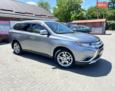 Серый Мицубиси Аутлендер, объемом двигателя 2.5 л и пробегом 205 тыс. км за 12400 $, фото 1 на Automoto.ua