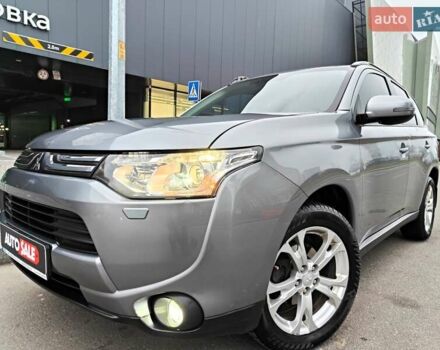 Серый Мицубиси Аутлендер, объемом двигателя 2.4 л и пробегом 209 тыс. км за 10990 $, фото 1 на Automoto.ua