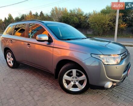 Серый Мицубиси Аутлендер, объемом двигателя 2.3 л и пробегом 250 тыс. км за 13999 $, фото 1 на Automoto.ua