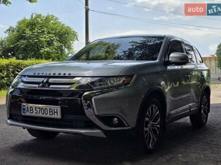 Серый Мицубиси Аутлендер, объемом двигателя 2.38 л и пробегом 153 тыс. км за 15200 $, фото 1 на Automoto.ua