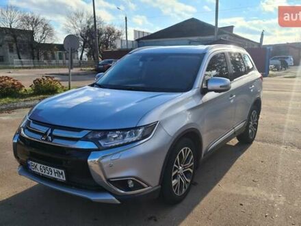 Серый Мицубиси Аутлендер, объемом двигателя 2.3 л и пробегом 253 тыс. км за 18500 $, фото 1 на Automoto.ua