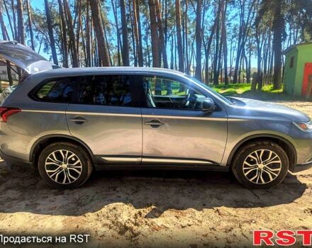 Серый Мицубиси Аутлендер, объемом двигателя 2.4 л и пробегом 252 тыс. км за 14800 $, фото 1 на Automoto.ua