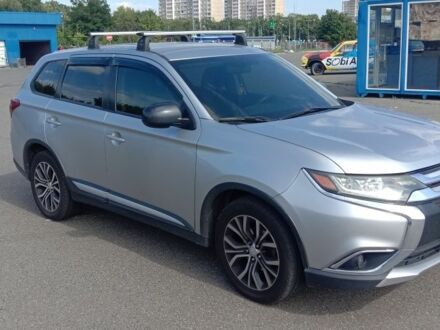 Серый Мицубиси Аутлендер, объемом двигателя 2.4 л и пробегом 100 тыс. км за 17700 $, фото 1 на Automoto.ua