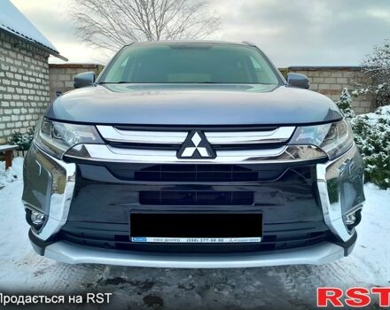 Серый Мицубиси Аутлендер, объемом двигателя 2.4 л и пробегом 77 тыс. км за 21500 $, фото 1 на Automoto.ua