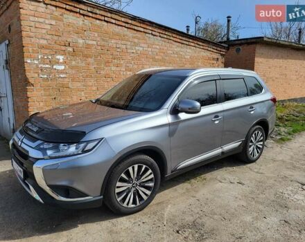 Серый Мицубиси Аутлендер, объемом двигателя 2.36 л и пробегом 125 тыс. км за 15500 $, фото 1 на Automoto.ua