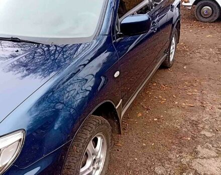 Синий Мицубиси Аутлендер, объемом двигателя 2 л и пробегом 195 тыс. км за 6500 $, фото 7 на Automoto.ua