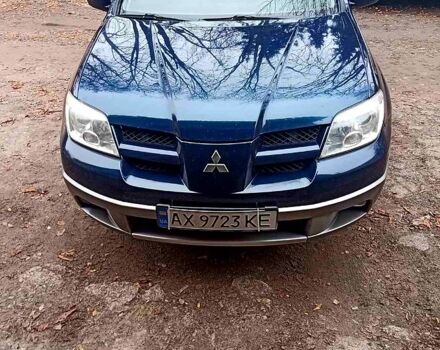 Синий Мицубиси Аутлендер, объемом двигателя 2 л и пробегом 195 тыс. км за 6500 $, фото 4 на Automoto.ua