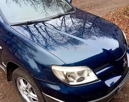 Синий Мицубиси Аутлендер, объемом двигателя 2 л и пробегом 195 тыс. км за 6500 $, фото 3 на Automoto.ua