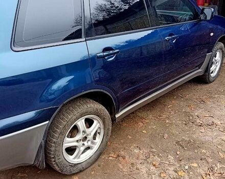 Синий Мицубиси Аутлендер, объемом двигателя 2 л и пробегом 195 тыс. км за 6500 $, фото 1 на Automoto.ua