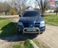 Синий Мицубиси Аутлендер, объемом двигателя 2 л и пробегом 340 тыс. км за 5100 $, фото 1 на Automoto.ua