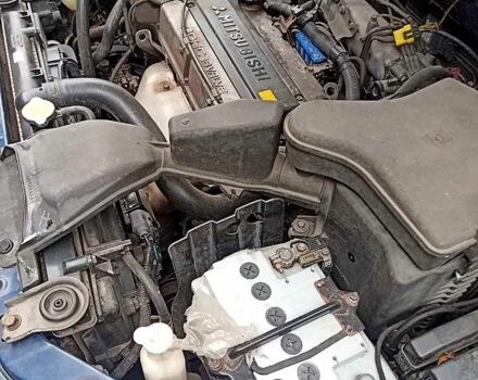 Синий Мицубиси Аутлендер, объемом двигателя 2 л и пробегом 195 тыс. км за 6500 $, фото 5 на Automoto.ua