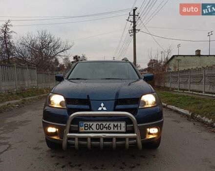Синий Мицубиси Аутлендер, объемом двигателя 2.38 л и пробегом 175 тыс. км за 6500 $, фото 2 на Automoto.ua