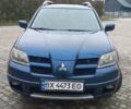 Синий Мицубиси Аутлендер, объемом двигателя 2 л и пробегом 400 тыс. км за 4400 $, фото 3 на Automoto.ua