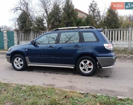 Синий Мицубиси Аутлендер, объемом двигателя 2.38 л и пробегом 175 тыс. км за 6500 $, фото 6 на Automoto.ua