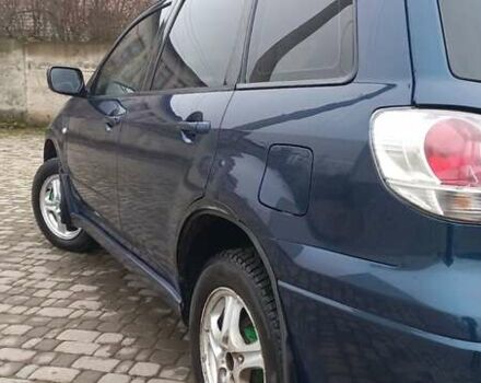 Синий Мицубиси Аутлендер, объемом двигателя 2 л и пробегом 400 тыс. км за 4400 $, фото 7 на Automoto.ua