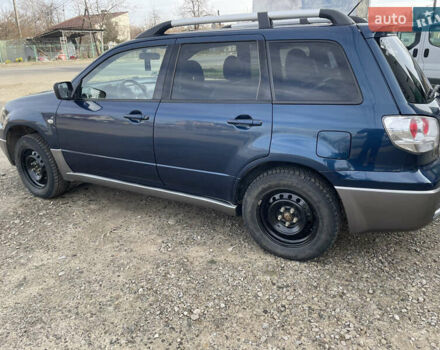 Синий Мицубиси Аутлендер, объемом двигателя 2 л и пробегом 231 тыс. км за 4900 $, фото 5 на Automoto.ua