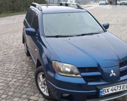 Синий Мицубиси Аутлендер, объемом двигателя 2 л и пробегом 400 тыс. км за 4400 $, фото 1 на Automoto.ua