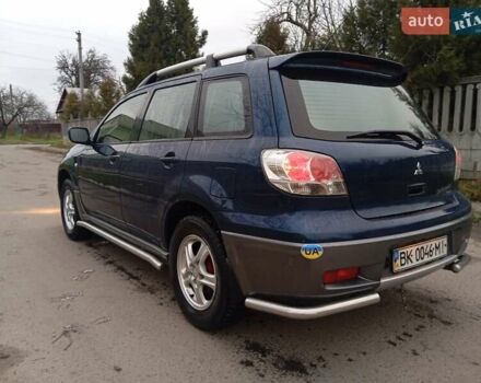 Синий Мицубиси Аутлендер, объемом двигателя 2.38 л и пробегом 175 тыс. км за 6500 $, фото 4 на Automoto.ua
