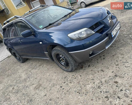 Синий Мицубиси Аутлендер, объемом двигателя 2 л и пробегом 231 тыс. км за 4900 $, фото 2 на Automoto.ua