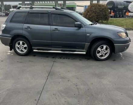 Синий Мицубиси Аутлендер, объемом двигателя 2.38 л и пробегом 300 тыс. км за 4200 $, фото 6 на Automoto.ua