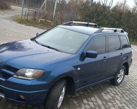 Синий Мицубиси Аутлендер, объемом двигателя 2 л и пробегом 400 тыс. км за 4400 $, фото 5 на Automoto.ua