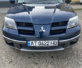 Синий Мицубиси Аутлендер, объемом двигателя 2 л и пробегом 231 тыс. км за 4900 $, фото 1 на Automoto.ua