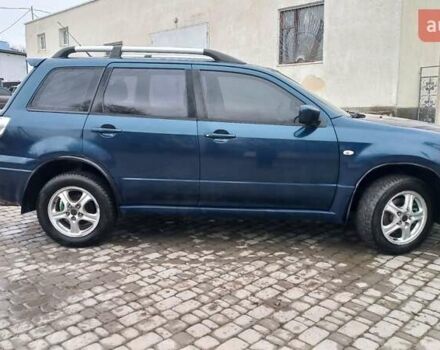 Синий Мицубиси Аутлендер, объемом двигателя 2 л и пробегом 400 тыс. км за 4400 $, фото 12 на Automoto.ua