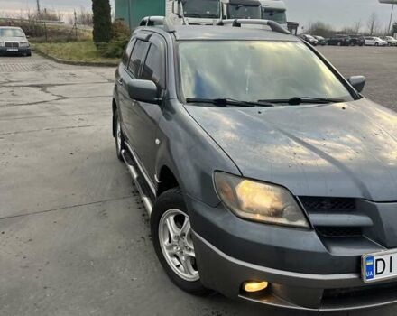 Синий Мицубиси Аутлендер, объемом двигателя 2.38 л и пробегом 300 тыс. км за 4200 $, фото 1 на Automoto.ua