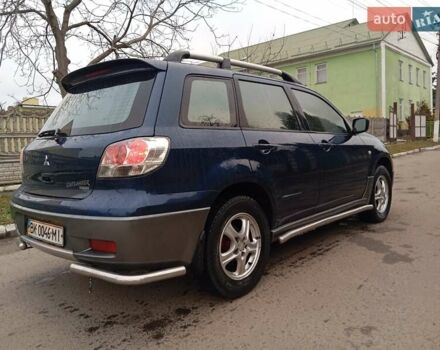 Синий Мицубиси Аутлендер, объемом двигателя 2.38 л и пробегом 175 тыс. км за 6500 $, фото 3 на Automoto.ua
