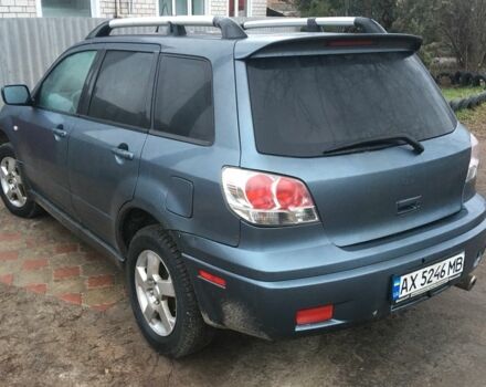 Синий Мицубиси Аутлендер, объемом двигателя 2.4 л и пробегом 218 тыс. км за 3500 $, фото 1 на Automoto.ua