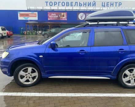 Синий Мицубиси Аутлендер, объемом двигателя 2 л и пробегом 234 тыс. км за 5500 $, фото 1 на Automoto.ua