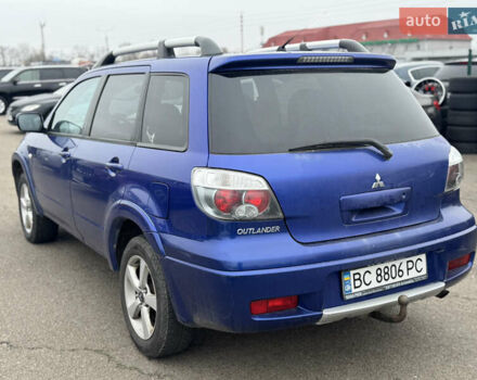Синий Мицубиси Аутлендер, объемом двигателя 2.4 л и пробегом 245 тыс. км за 4600 $, фото 3 на Automoto.ua