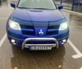 Синий Мицубиси Аутлендер, объемом двигателя 2 л и пробегом 234 тыс. км за 5500 $, фото 1 на Automoto.ua