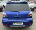 Синий Мицубиси Аутлендер, объемом двигателя 2.4 л и пробегом 245 тыс. км за 4600 $, фото 4 на Automoto.ua