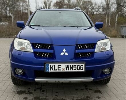 Синий Мицубиси Аутлендер, объемом двигателя 2.4 л и пробегом 243 тыс. км за 5000 $, фото 4 на Automoto.ua