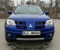 Синий Мицубиси Аутлендер, объемом двигателя 2.4 л и пробегом 243 тыс. км за 5000 $, фото 4 на Automoto.ua