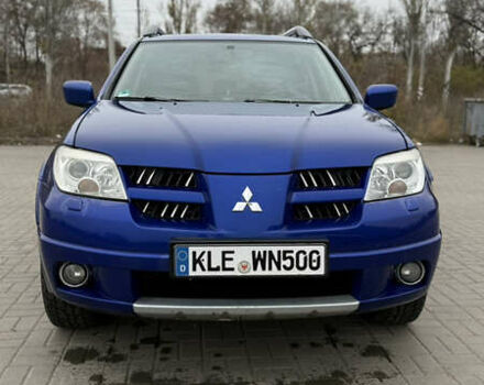 Синий Мицубиси Аутлендер, объемом двигателя 2.4 л и пробегом 243 тыс. км за 5000 $, фото 4 на Automoto.ua