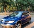 Синий Мицубиси Аутлендер, объемом двигателя 2 л и пробегом 287 тыс. км за 6100 $, фото 1 на Automoto.ua