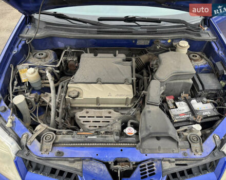 Синий Мицубиси Аутлендер, объемом двигателя 2.4 л и пробегом 245 тыс. км за 4600 $, фото 13 на Automoto.ua