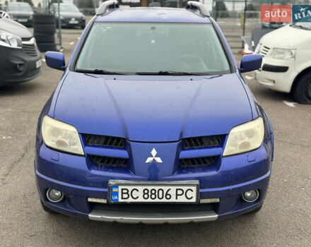 Синий Мицубиси Аутлендер, объемом двигателя 2.4 л и пробегом 245 тыс. км за 4600 $, фото 1 на Automoto.ua