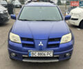Синий Мицубиси Аутлендер, объемом двигателя 2.4 л и пробегом 245 тыс. км за 4600 $, фото 1 на Automoto.ua