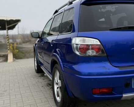 Синий Мицубиси Аутлендер, объемом двигателя 2.4 л и пробегом 243 тыс. км за 5000 $, фото 12 на Automoto.ua