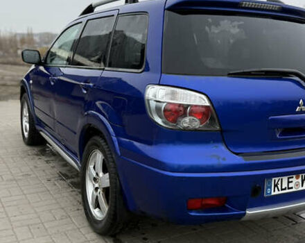 Синий Мицубиси Аутлендер, объемом двигателя 2.4 л и пробегом 243 тыс. км за 5000 $, фото 13 на Automoto.ua